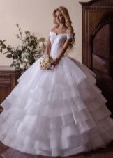 Magnificent wedding dress with a multi-tiered skirt