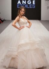 Magnificent wedding dress with a multi-layer skirt