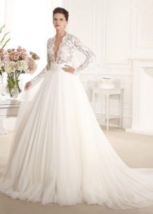 Wedding dress with openwork sleeve and low neckline