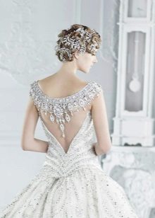 Wedding dress with an open back illusion with decor