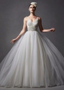 Wedding dress in the style of a princess with a multi-layered skirt