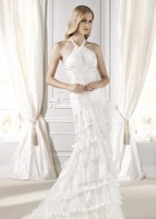 Wedding dress with a strap rounding the neck