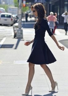 Dark blue dress with a fluffy skirt of medium length