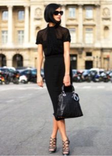 Office dress in black with a spacious top and narrowed skirt to the bottom