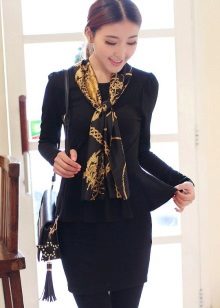 Black dress of business style in combination with a scarf