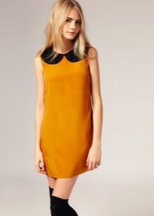 Mustard dress with black collar in the style of the 60s