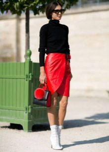 Red leather skirt with wrap pencil combined with white boots and a black turtleneck