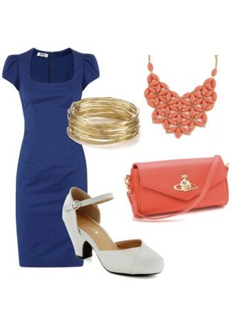 Orange accessories to a dark blue dress