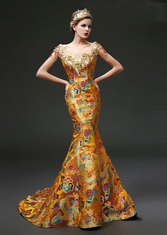 Dress of golden color in oriental style with national drawings