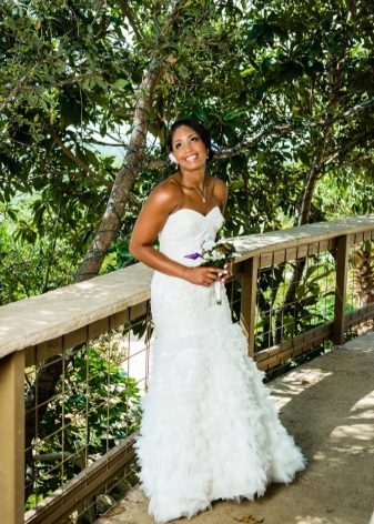 Bridal bouquet to a wedding dress with a high waist