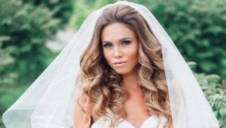 Wedding hairstyles with a veil on long hair: a variety of options and examples of their implementation