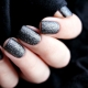 Black manicure with sparkles - brightness and elegance