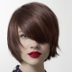 Haircuts with oblique bangs on medium hair