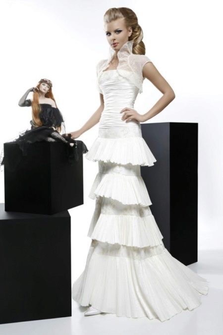 Wedding dress from the collection Courage with a multi-tiered skirt