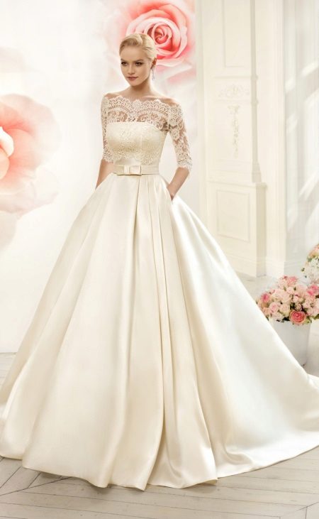 Luxurious wedding dress with sleeves and lace top