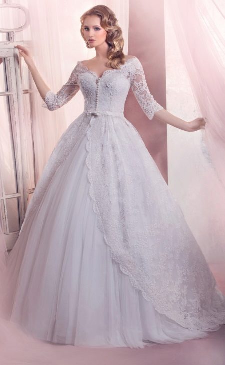 Magnificent wedding dress with sleeves in the style of a princess