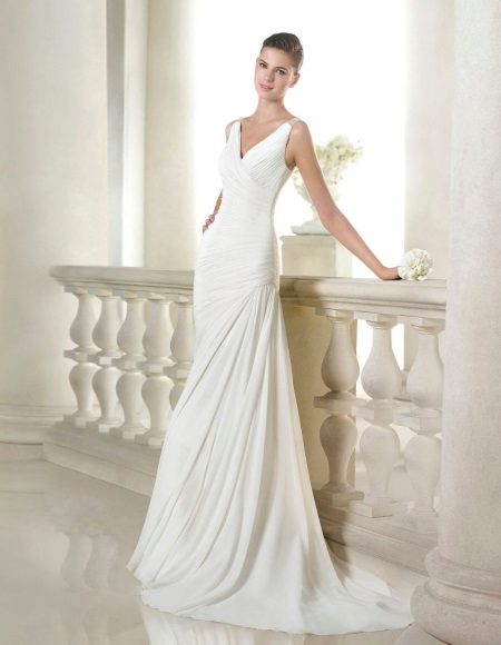 Wedding dress with neckline and drape