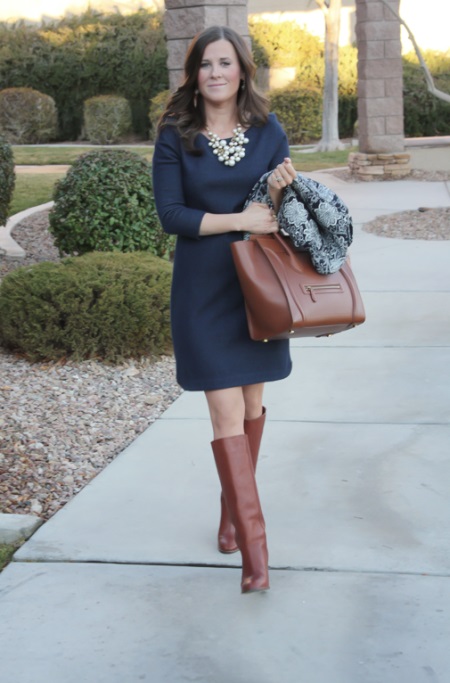 Flesh-colored tights under a dark blue dress